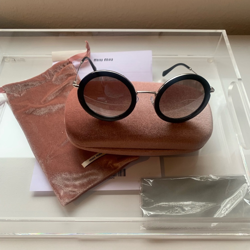 Mui Mui Sunglasses.